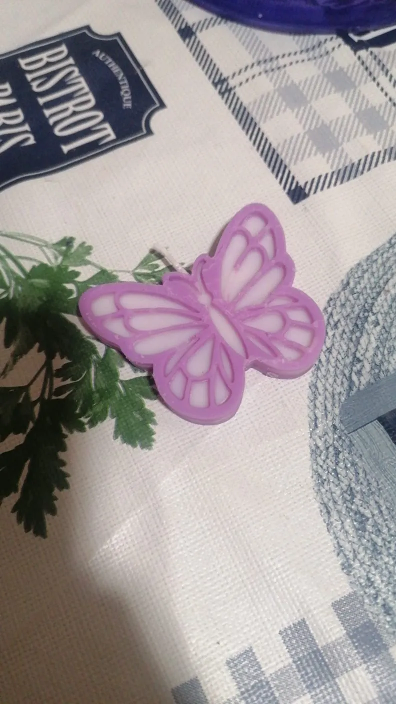 Vela en forma de mariposa